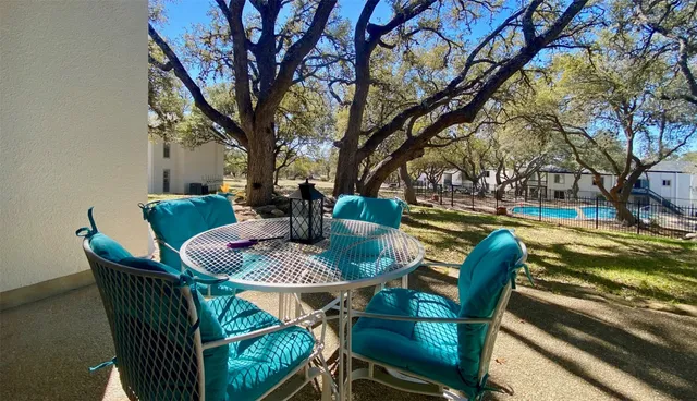 a view of backyard of house with seating space