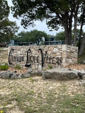 a view of swimming pool with outdoor seating and plants