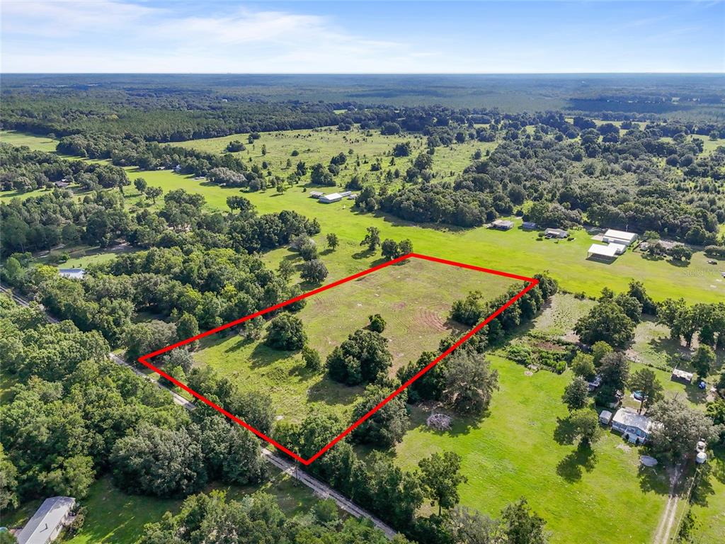Southwest 157th Terrace Archer, FL 32618 - Photo 2 of 14 an aerial view of mountains and trees