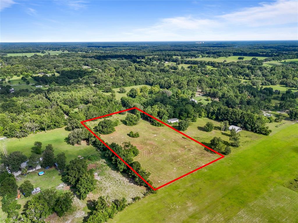 Southwest 157th Terrace Archer, FL 32618 - Photo 3 of 14 a view of a yard with an outdoor seating