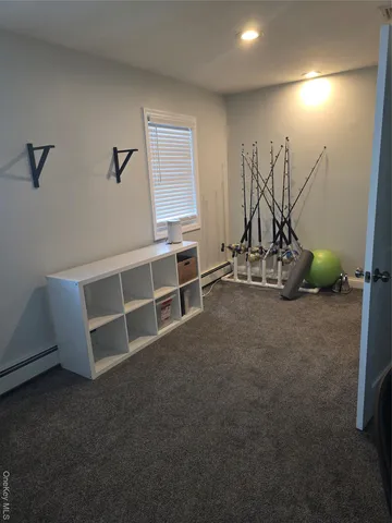 a view of a room with furniture and windows