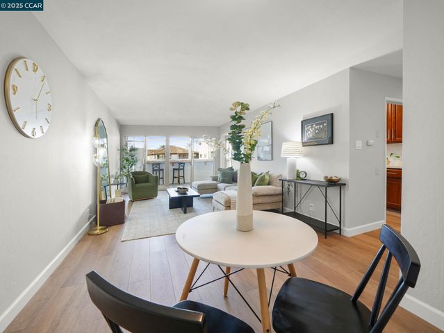 a kitchen with stainless steel appliances granite countertop a refrigerator a stove and a sink with cabinets