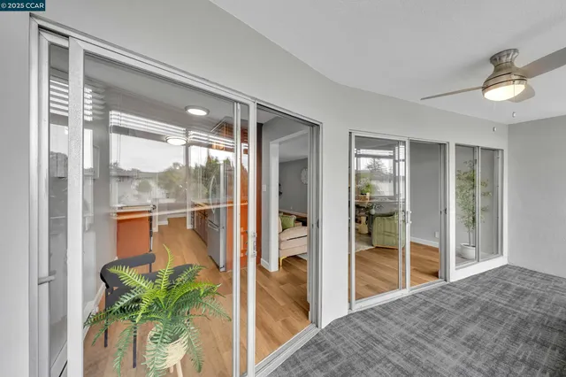 a bed room with a bed mirror and a window