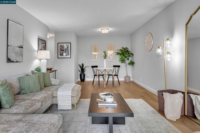 a living room with furniture rug and window