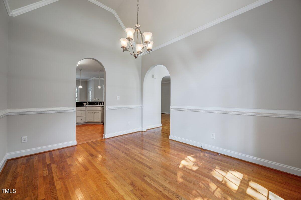 1321 Taylor Farm Road Raleigh, NC 27603 - Photo 19 of 41 wooden floor in an empty room with a window