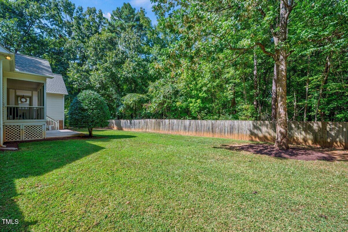1321 Taylor Farm Road Raleigh, NC 27603 - Photo 38 of 41 a view of a backyard with a small cabin