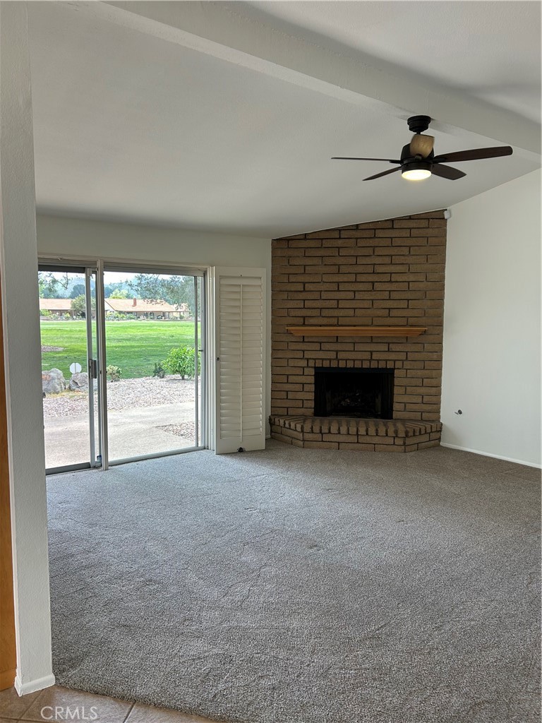 1915 Silver Oak Way Hemet, CA 92545 - Photo 7 of 17 a view of empty room with front door