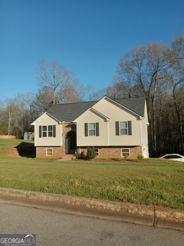 35 Maggie Court Covington, GA 30016 - Photo 1 of 1 a front view of a house with a yard