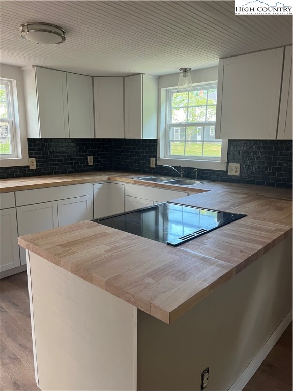9635 Highway 194 Lansing, NC 28643 - Photo 13 of 28 a kitchen with granite countertop a sink a stove and cabinets