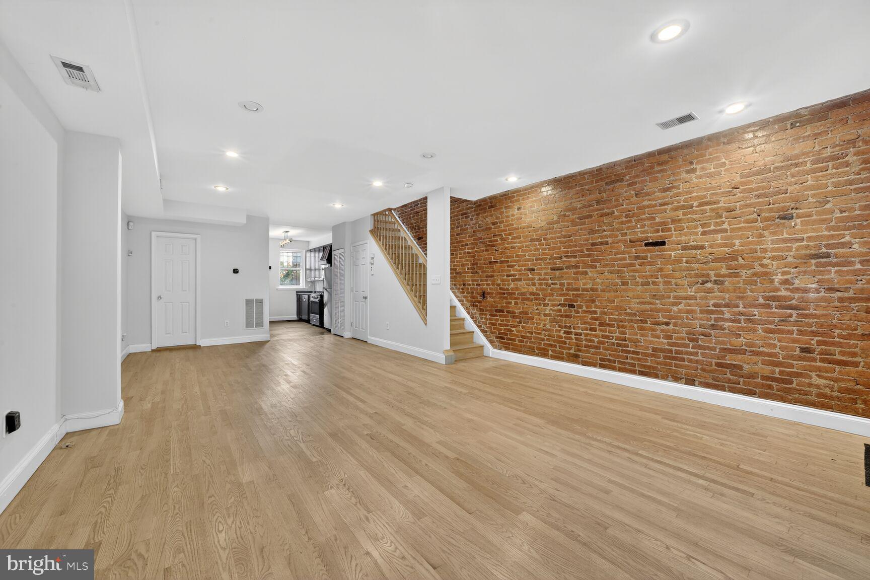 1251 I Street Northeast Washington, DC 20002 - Photo 18 of 31 a view of empty room with wooden floor