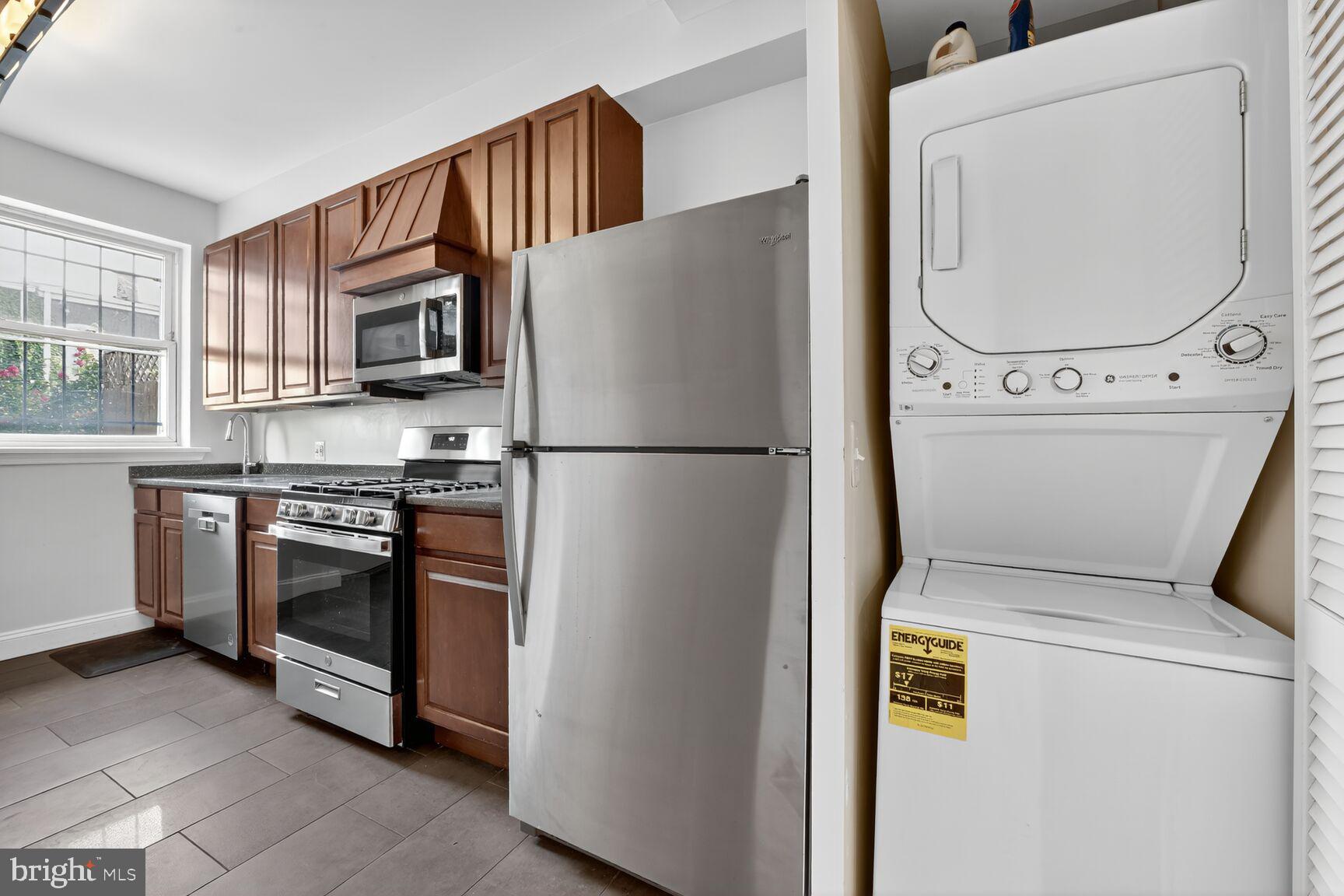 1251 I Street Northeast Washington, DC 20002 - Photo 21 of 31 a kitchen with a refrigerator sink and a stove top oven