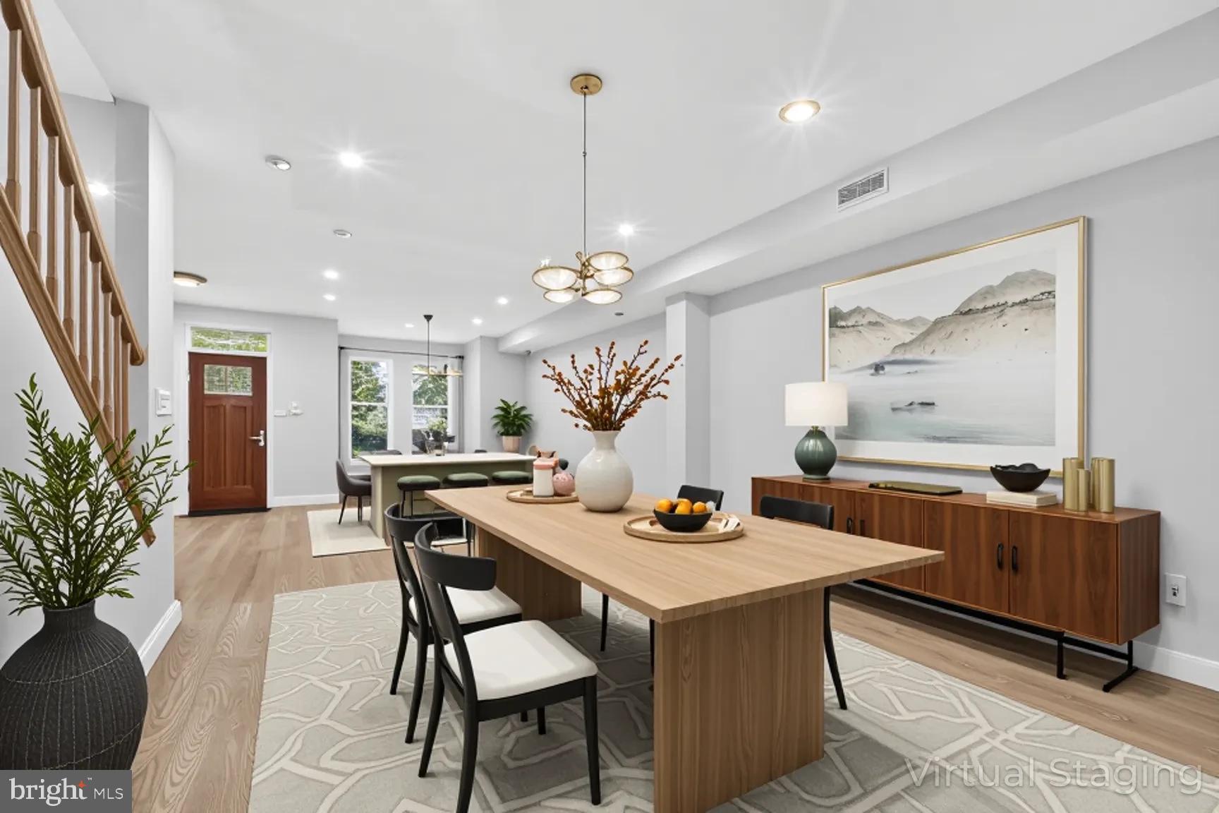1251 I Street Northeast Washington, DC 20002 - Photo 4 of 31 a view of a dining room with furniture and chandelier