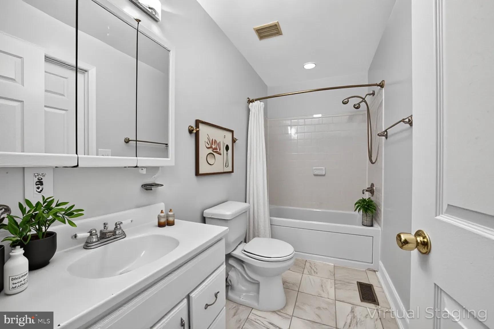 1251 I Street Northeast Washington, DC 20002 - Photo 10 of 31 a bathroom with a sink a toilet a tub and shower