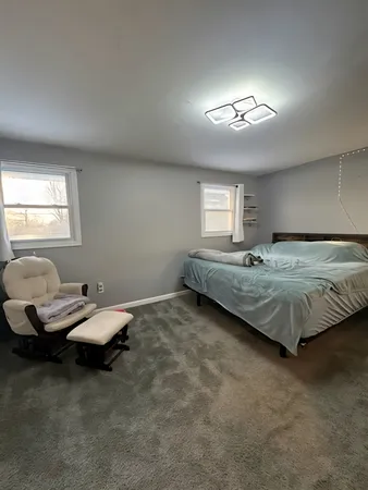 a bedroom with a bed and furniture