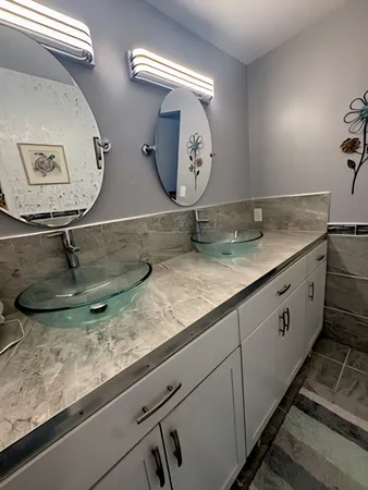 a bathroom with a window and a shower