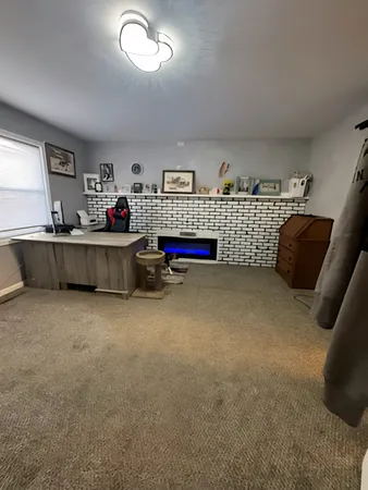 a living room with furniture and window