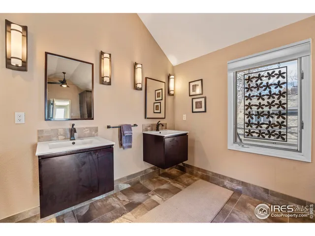 a bathroom with a sink a mirror and a bathtub