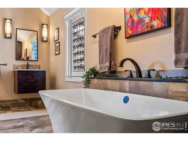 a bathroom with a sink mirror and vanity