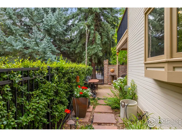 a view of a backyard with sitting area