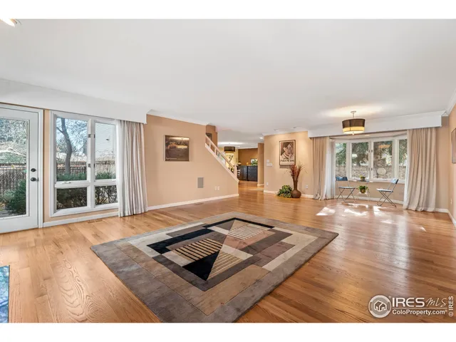 a living room with furniture rug and window