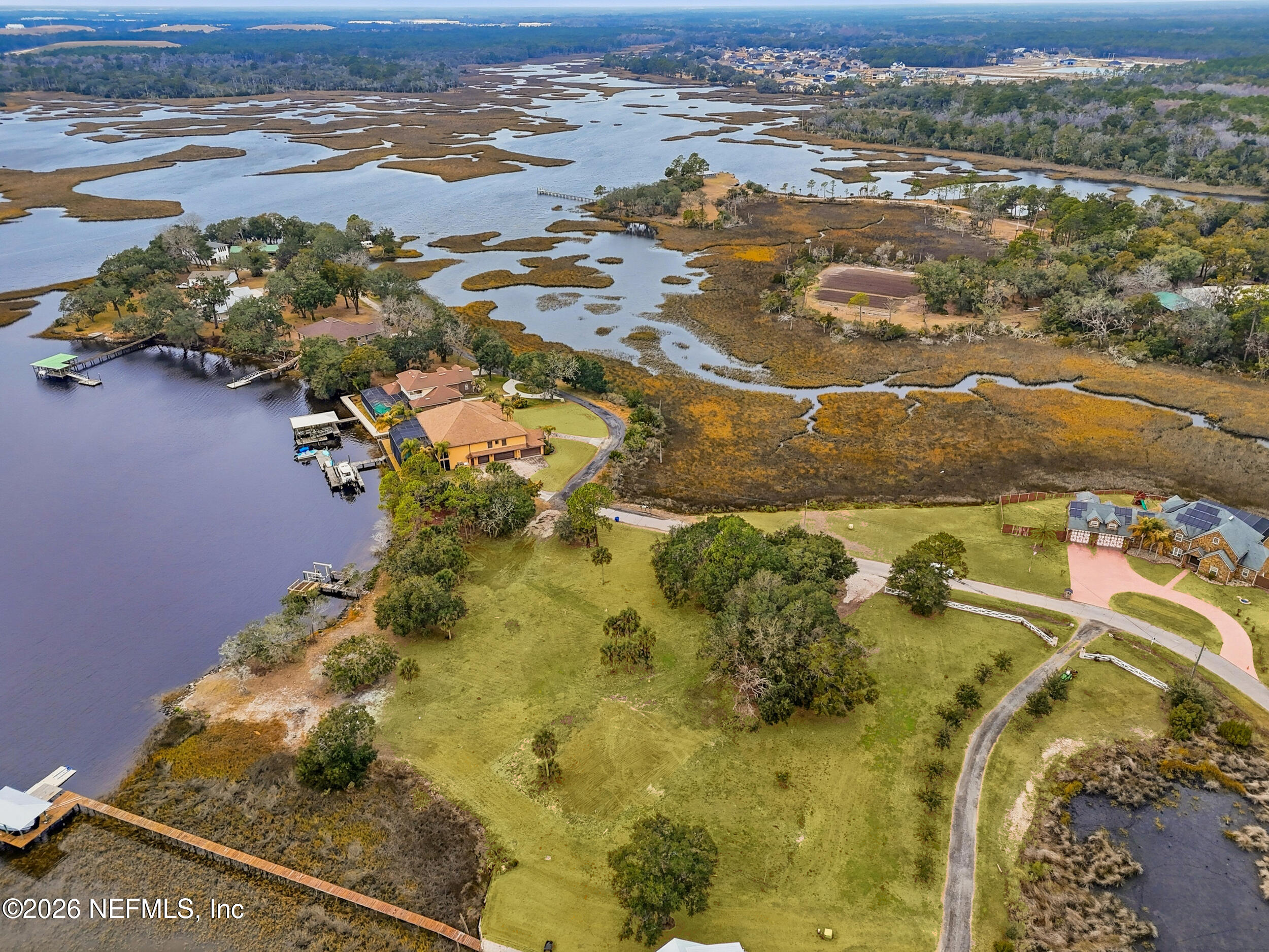 5895 Sheffield Road Jacksonville, FL 32226 - Photo 12 of 13 an aerial view of residential houses with outdoor space