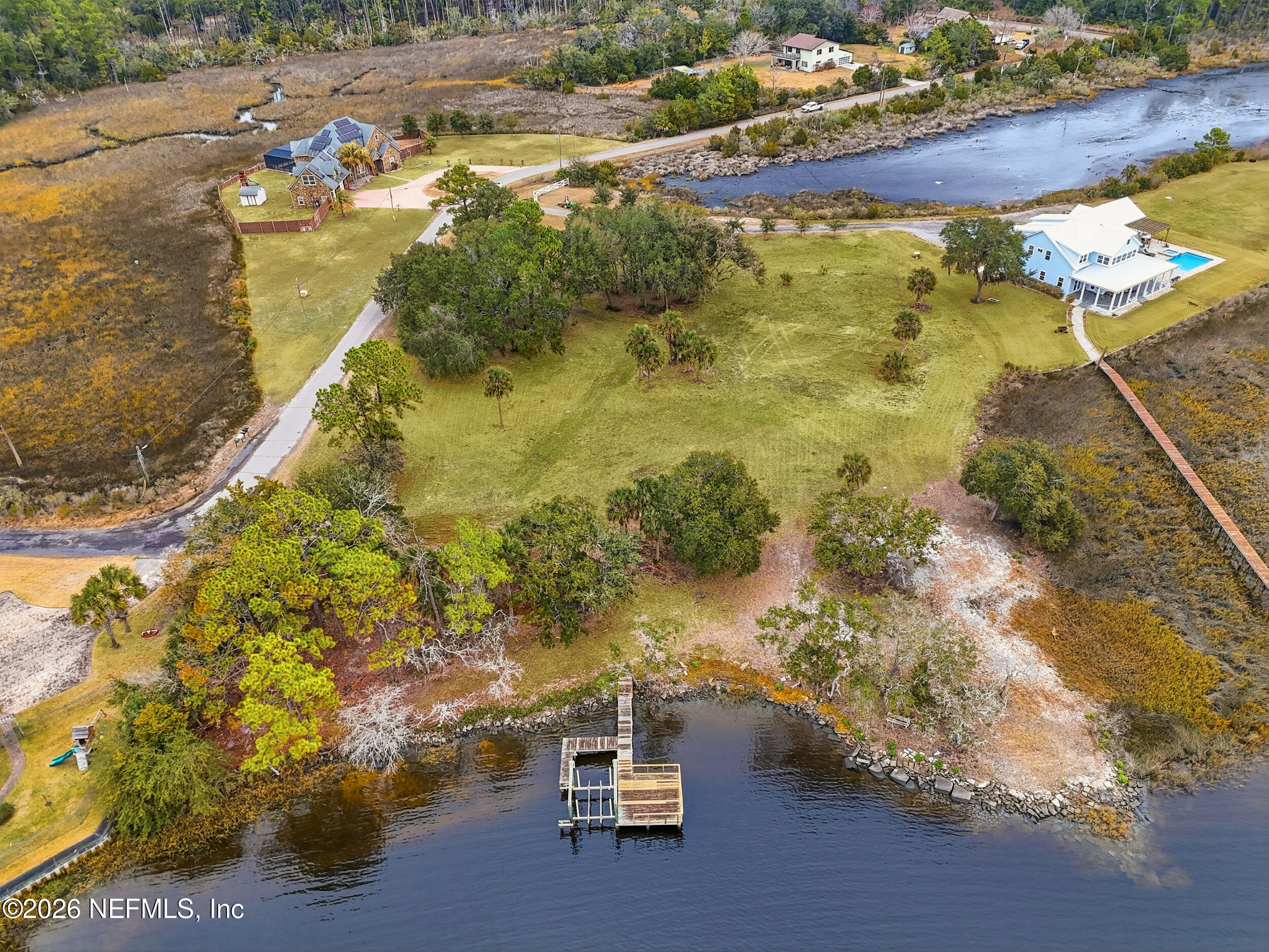 5895 Sheffield Road Jacksonville, FL 32226 - Photo 9 of 13 a room with water heater and wooden floor