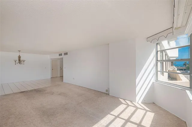 a view of an empty room and window