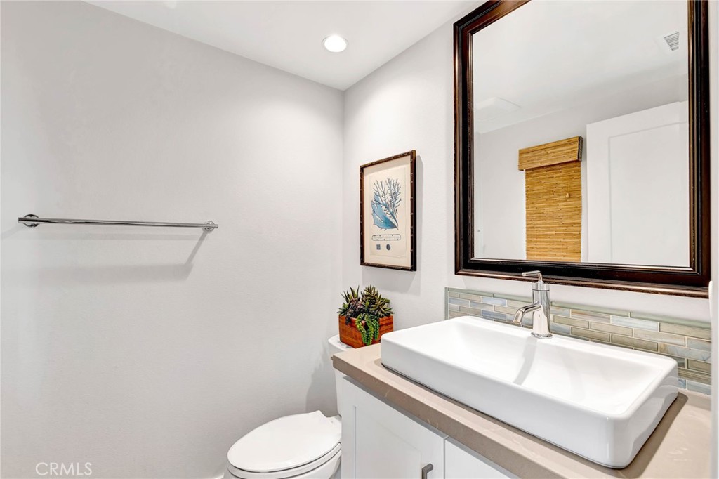 100 Della Irvine, CA 92602 - Photo 8 of 31 Upgraded powder room with built in sink and custom tile