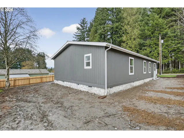 a house with trees in the background