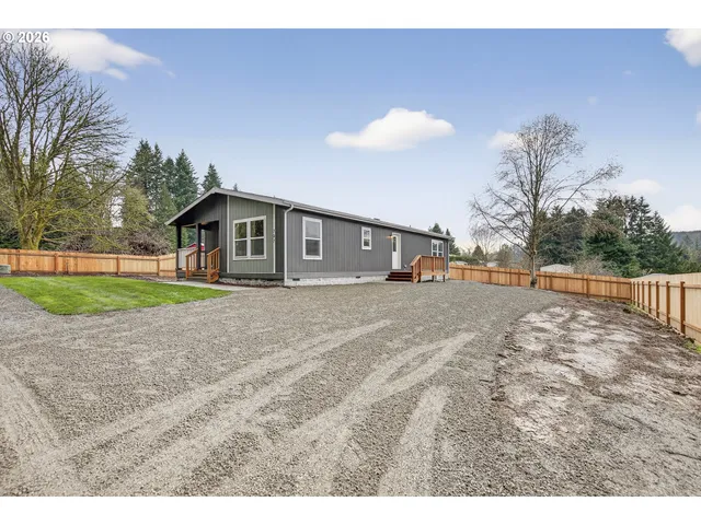 a view of outdoor space with yard and mountain view in back