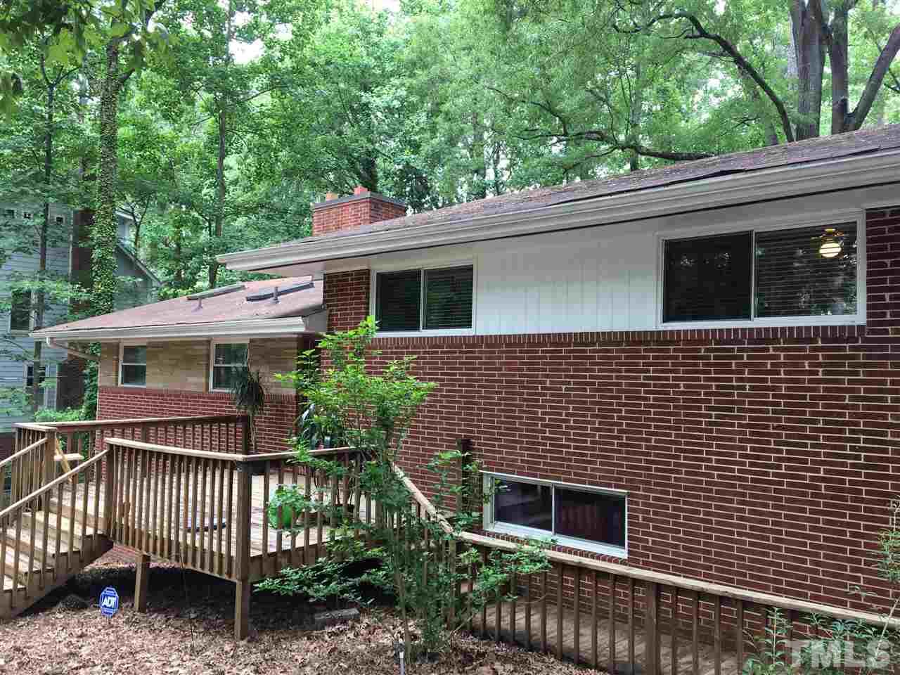 3614 Hope Valley Road Durham, NC 27707 - Photo 1 of 4 a front view of a house with a garden
