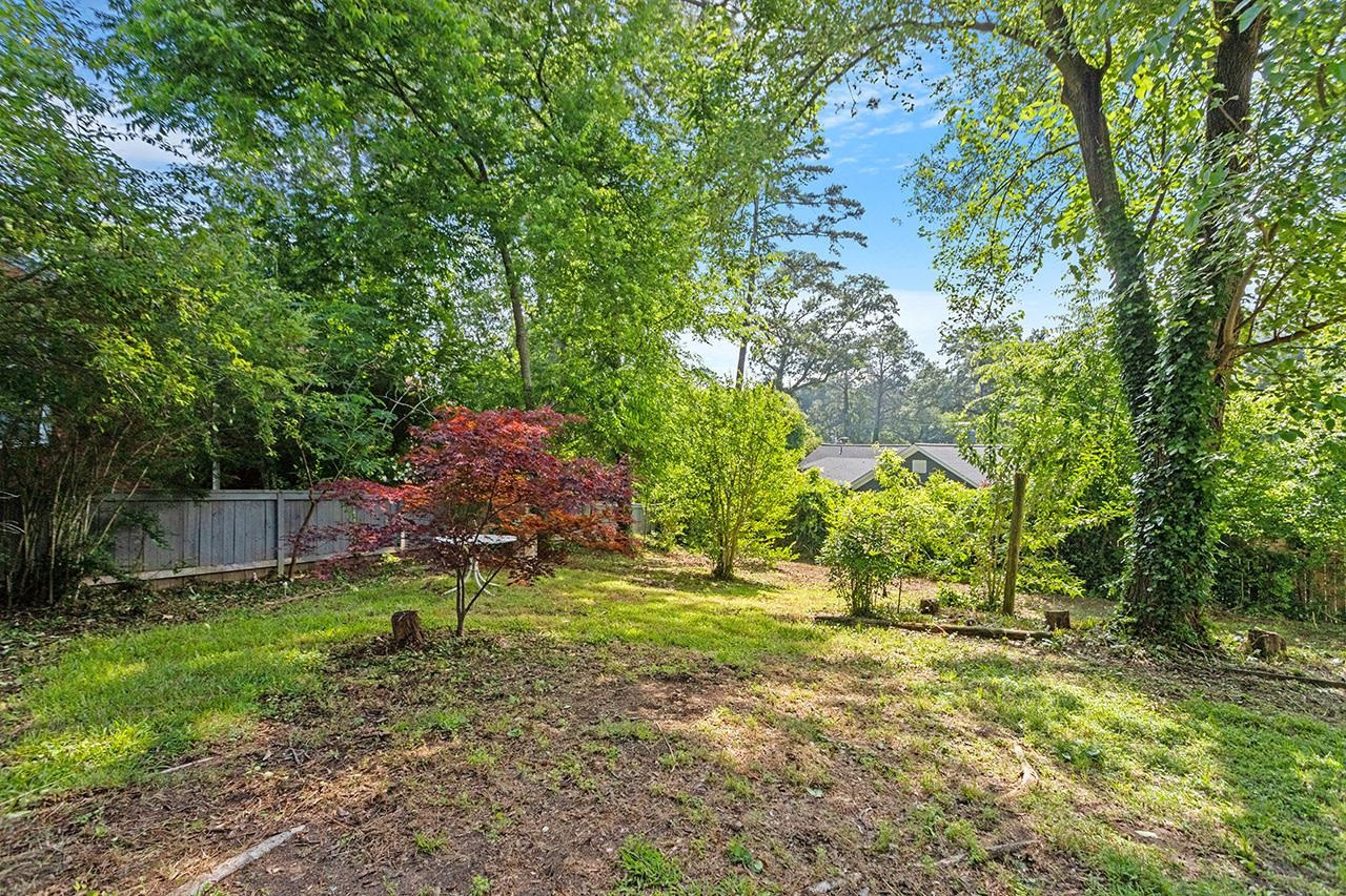 1208 Clifton Street Raleigh, NC 27604 - Photo 5 of 33 Spacious .22 acre lot gives slight mountain vibes and is large enough for expansion or new construction and to still have a yard