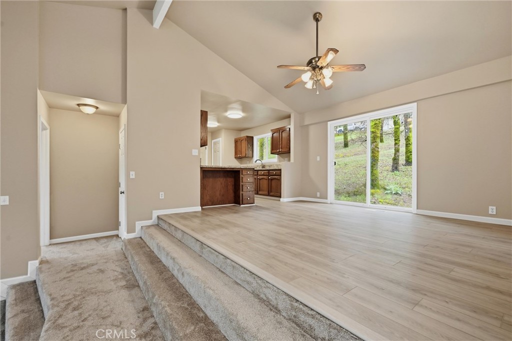 19474 Donkey Hill Road Hidden Valley Lake, CA 95467 - Photo 12 of 38 a view of an empty room with window and wooden floor