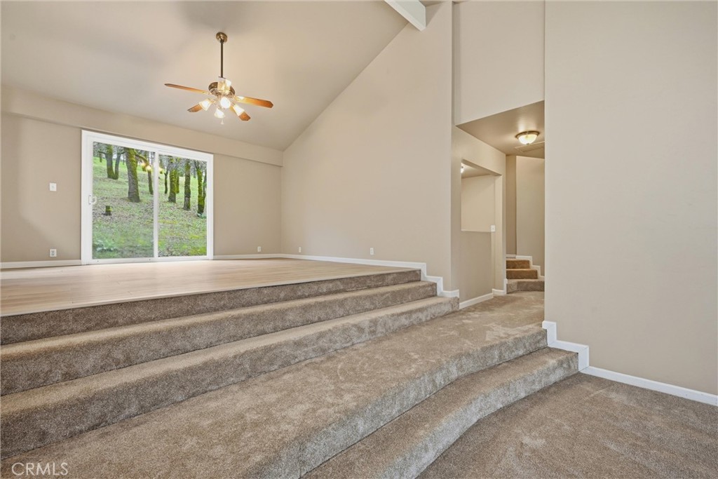 19474 Donkey Hill Road Hidden Valley Lake, CA 95467 - Photo 15 of 38 a view of a livingroom with a fireplace and chandelier