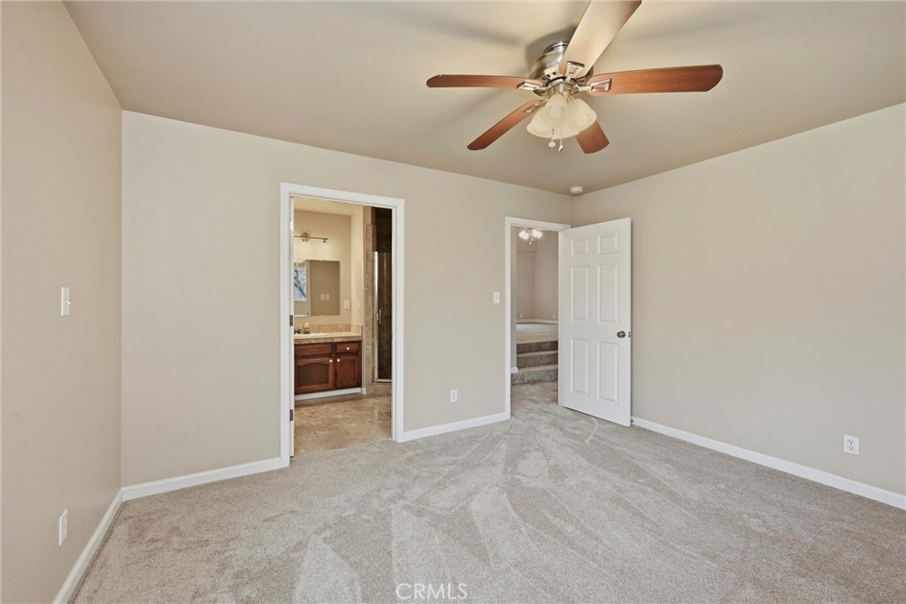 19474 Donkey Hill Road Hidden Valley Lake, CA 95467 - Photo 17 of 38 a view of an empty room with a ceiling fan
