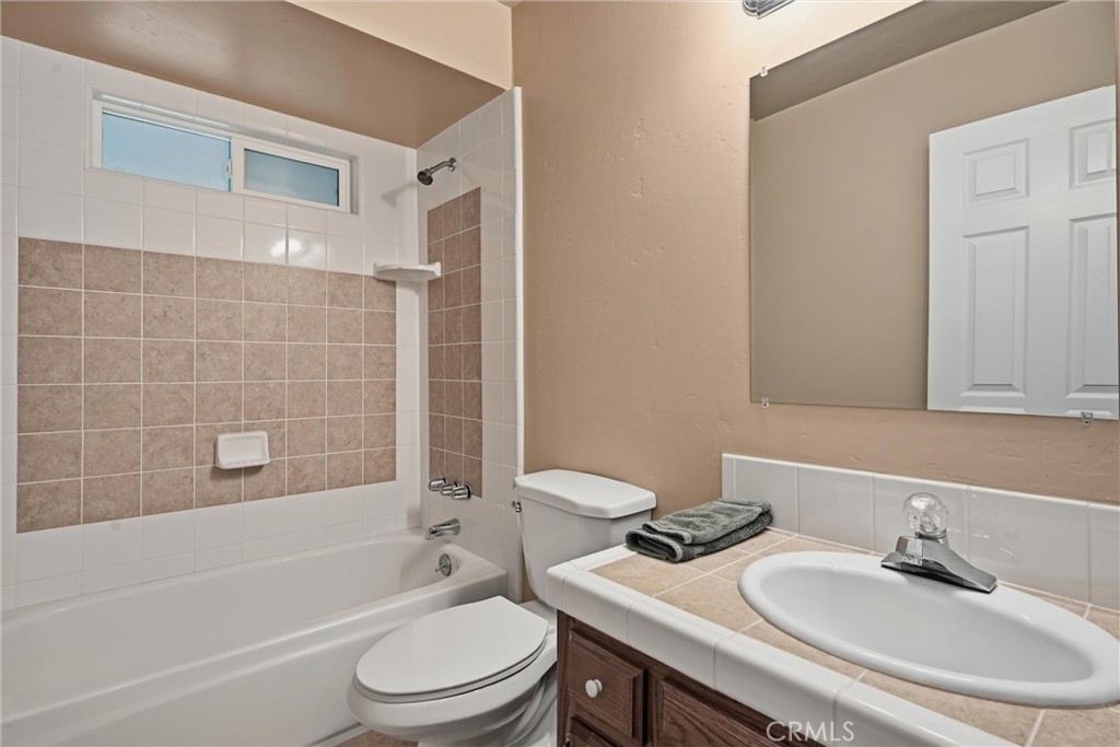 19474 Donkey Hill Road Hidden Valley Lake, CA 95467 - Photo 23 of 38 a bathroom with a sink toilet and shower