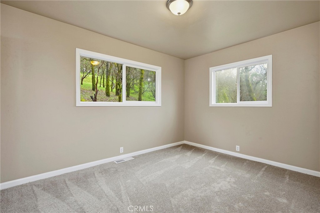 19474 Donkey Hill Road Hidden Valley Lake, CA 95467 - Photo 24 of 38 an empty room with a window