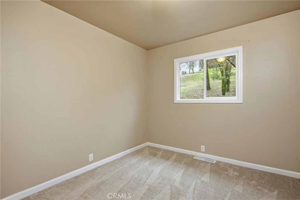 19474 Donkey Hill Road Hidden Valley Lake, CA 95467 - Photo 25 of 38 an empty room with a window