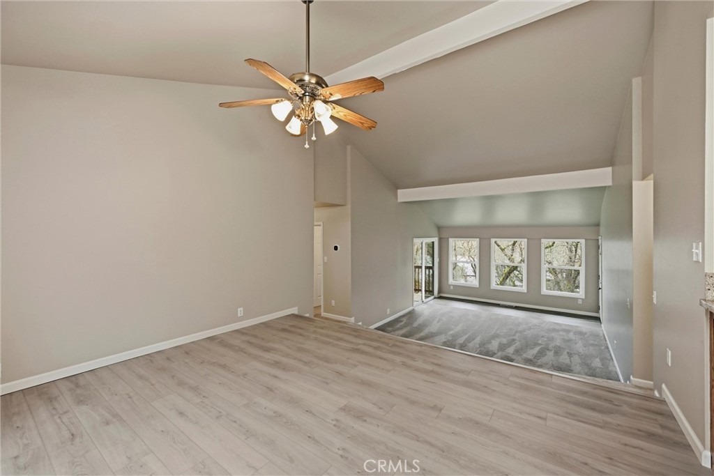 19474 Donkey Hill Road Hidden Valley Lake, CA 95467 - Photo 3 of 38 wooden floor in an empty room with a window