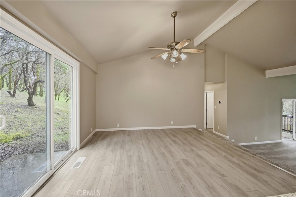 19474 Donkey Hill Road Hidden Valley Lake, CA 95467 - Photo 8 of 38 wooden floor in an empty room with a window