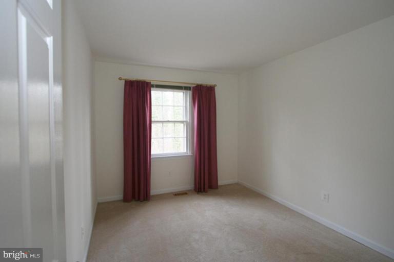 1003 Windrush Lane, Unit 16 Sandy Spring, MD 20860 - Photo 6 of 9 Sunny 2nd bedroom with large closet