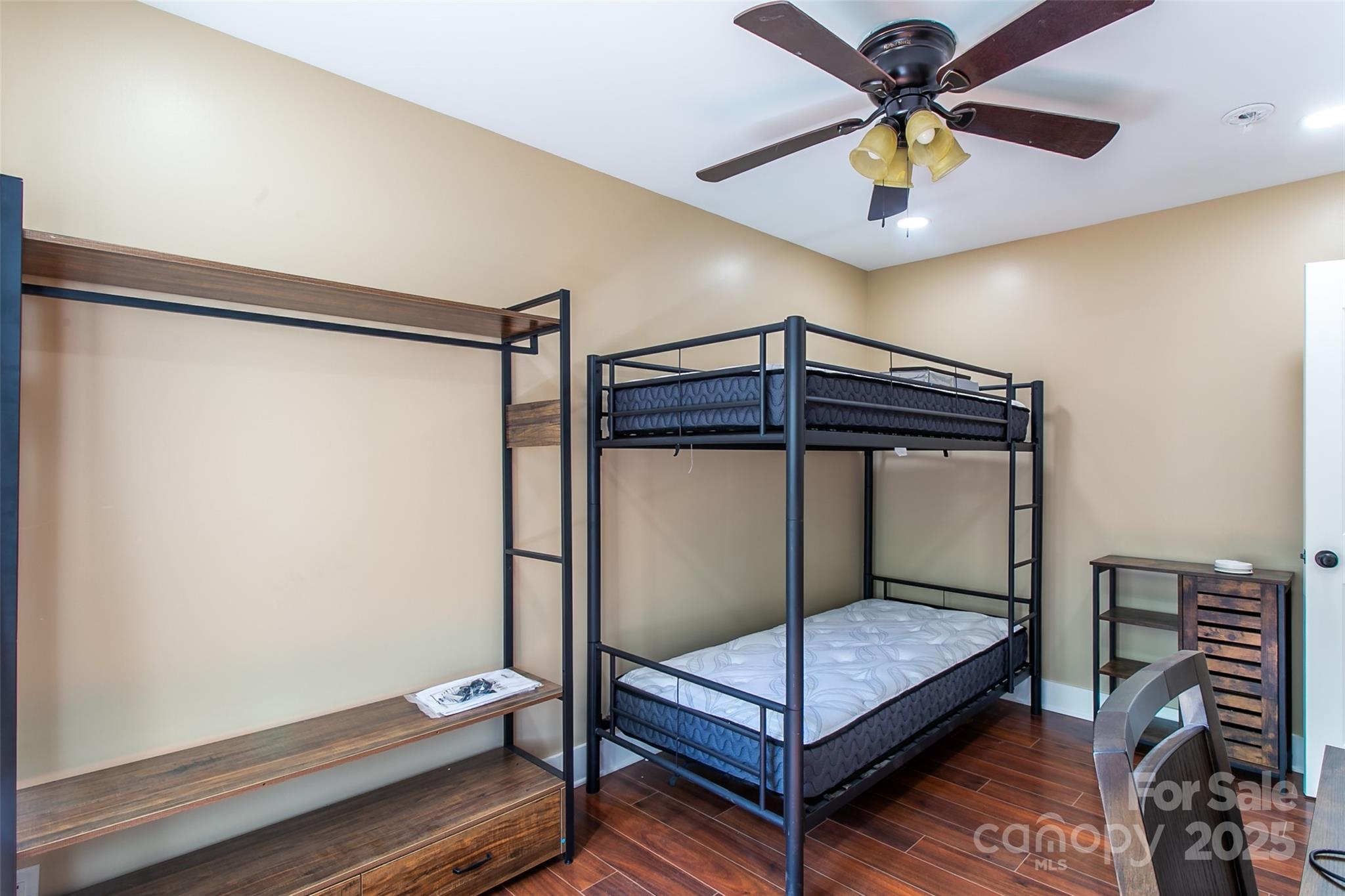 115 Cold Springs Drive Mill Spring, NC 28756 - Photo 12 of 42 a bedroom with a bed and a fan