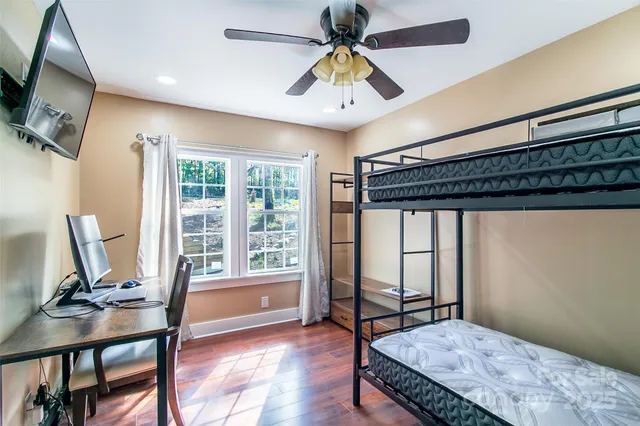 a bedroom with furniture and a window