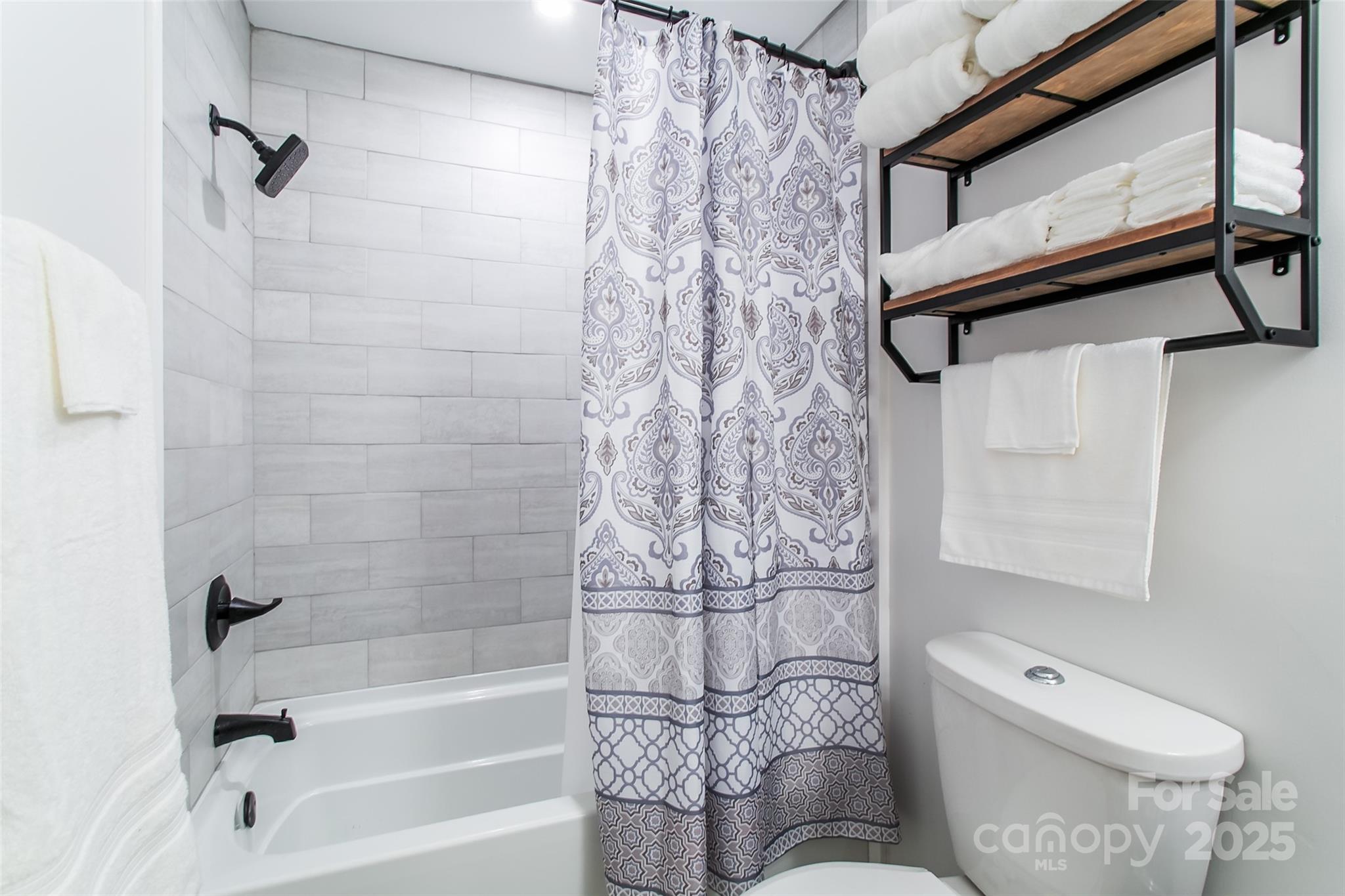 115 Cold Springs Drive Mill Spring, NC 28756 - Photo 15 of 42 a bathroom with a toilet and a shower