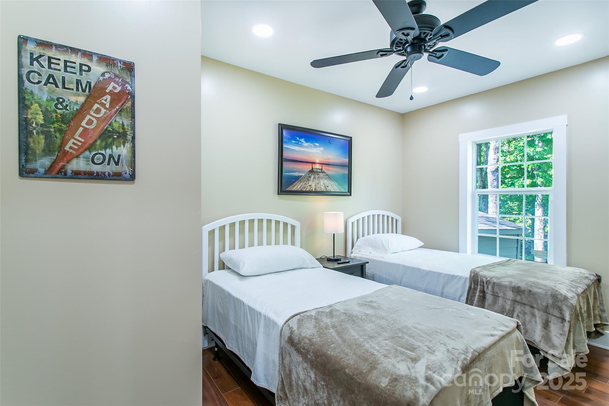 115 Cold Springs Drive Mill Spring, NC 28756 - Photo 16 of 42 a bedroom with two beds and a window