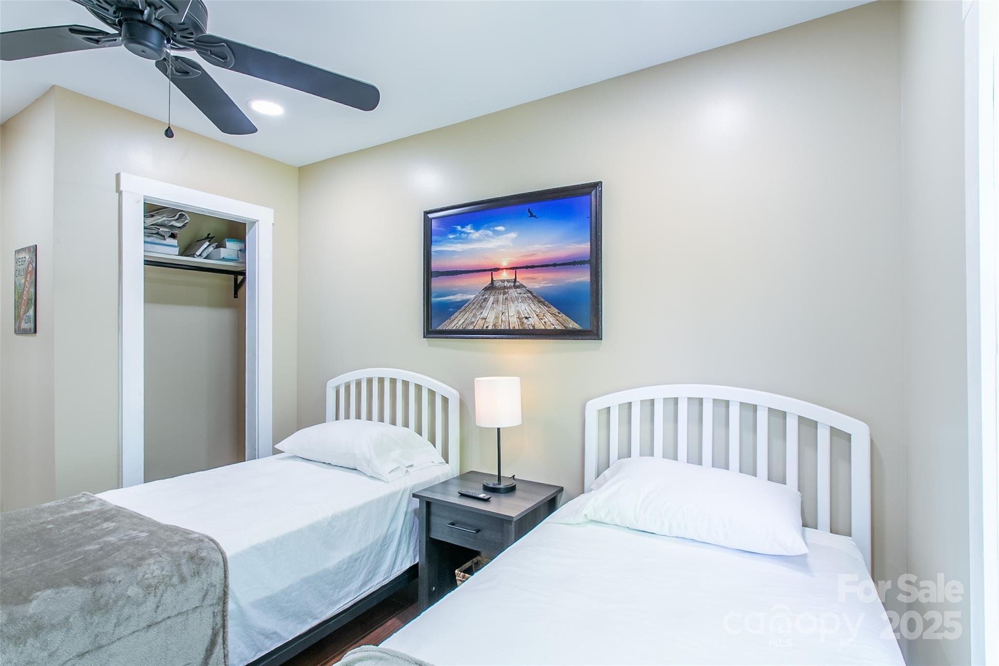 115 Cold Springs Drive Mill Spring, NC 28756 - Photo 19 of 42 a bedroom with bed and a window