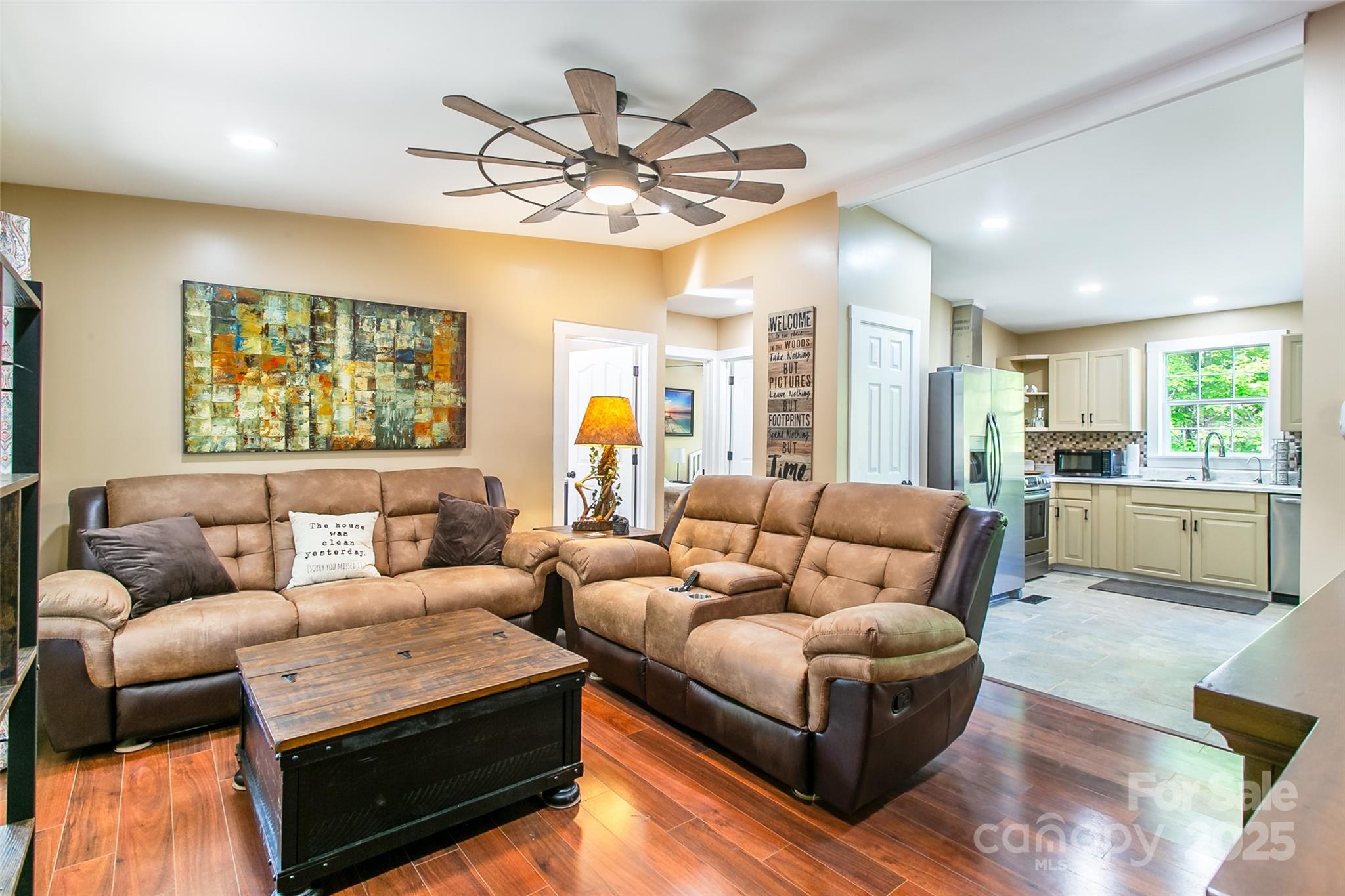 115 Cold Springs Drive Mill Spring, NC 28756 - Photo 22 of 42 a living room with furniture kitchen and a chandelier