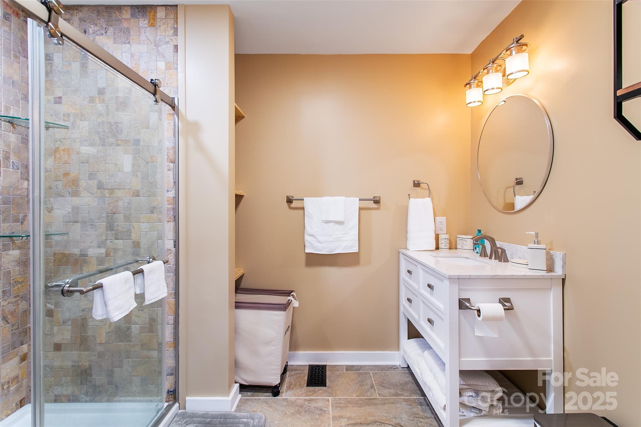 115 Cold Springs Drive Mill Spring, NC 28756 - Photo 24 of 42 a bathroom with a sink mirror and toilet