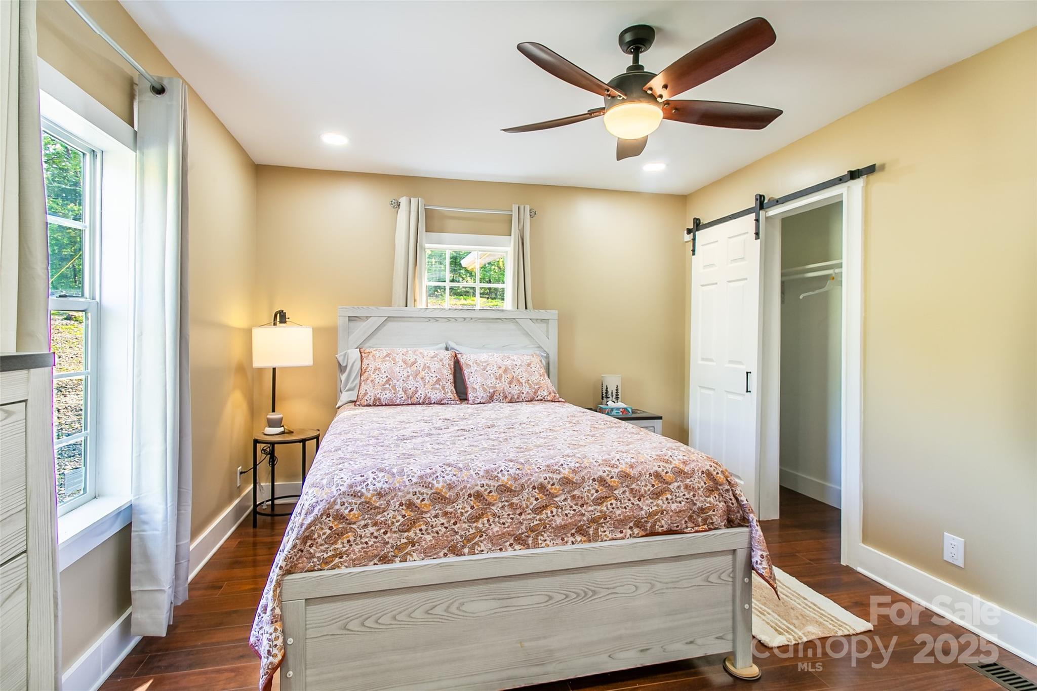 115 Cold Springs Drive Mill Spring, NC 28756 - Photo 29 of 42 a bedroom with a bed and wooden floor