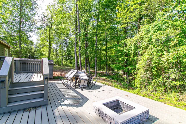 a view of a patio with chairs and a yard
